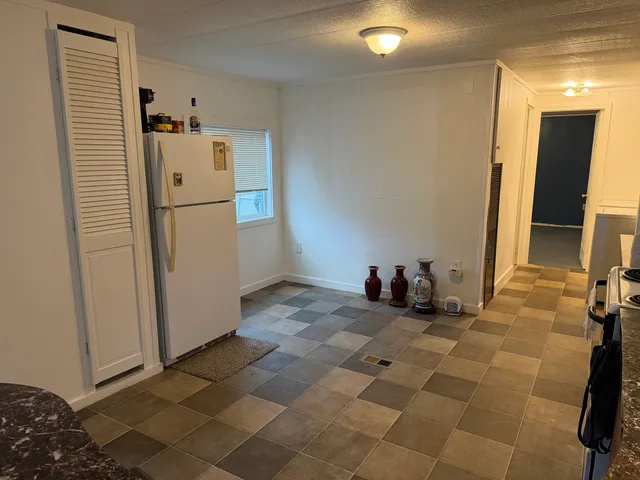 a lobby with furniture and a rug