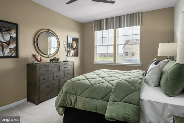 a bedroom with a bed a closet and a window