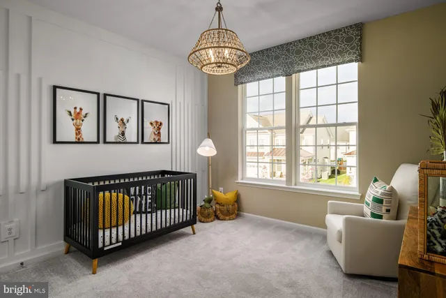 a bedroom with windows and a chandelier