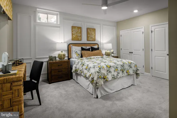 a bedroom with a bed furniture and a window