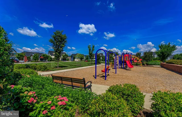 a view of a park with swings and slides