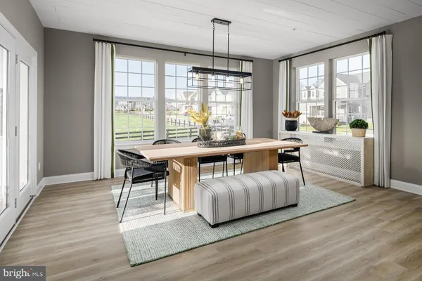 a room with furniture wooden floor and windows