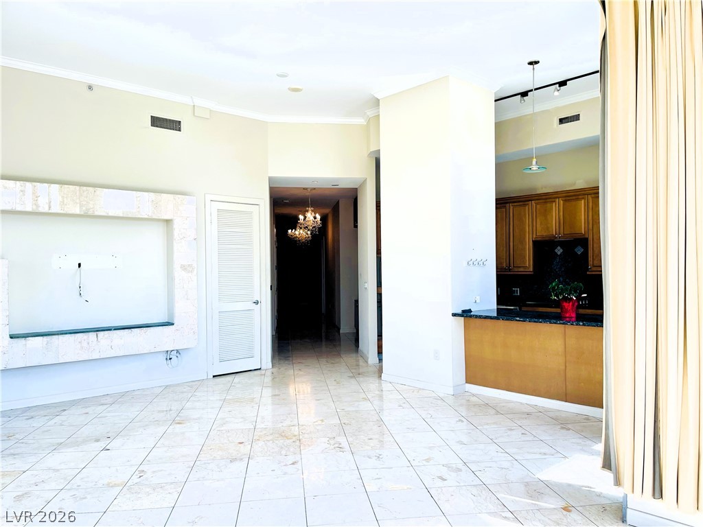 360 East Desert Inn Road, Unit 507 Las Vegas, NV 89109 - Photo 6 of 37 Polished tile flooring and high ceilings define this open interior layout.