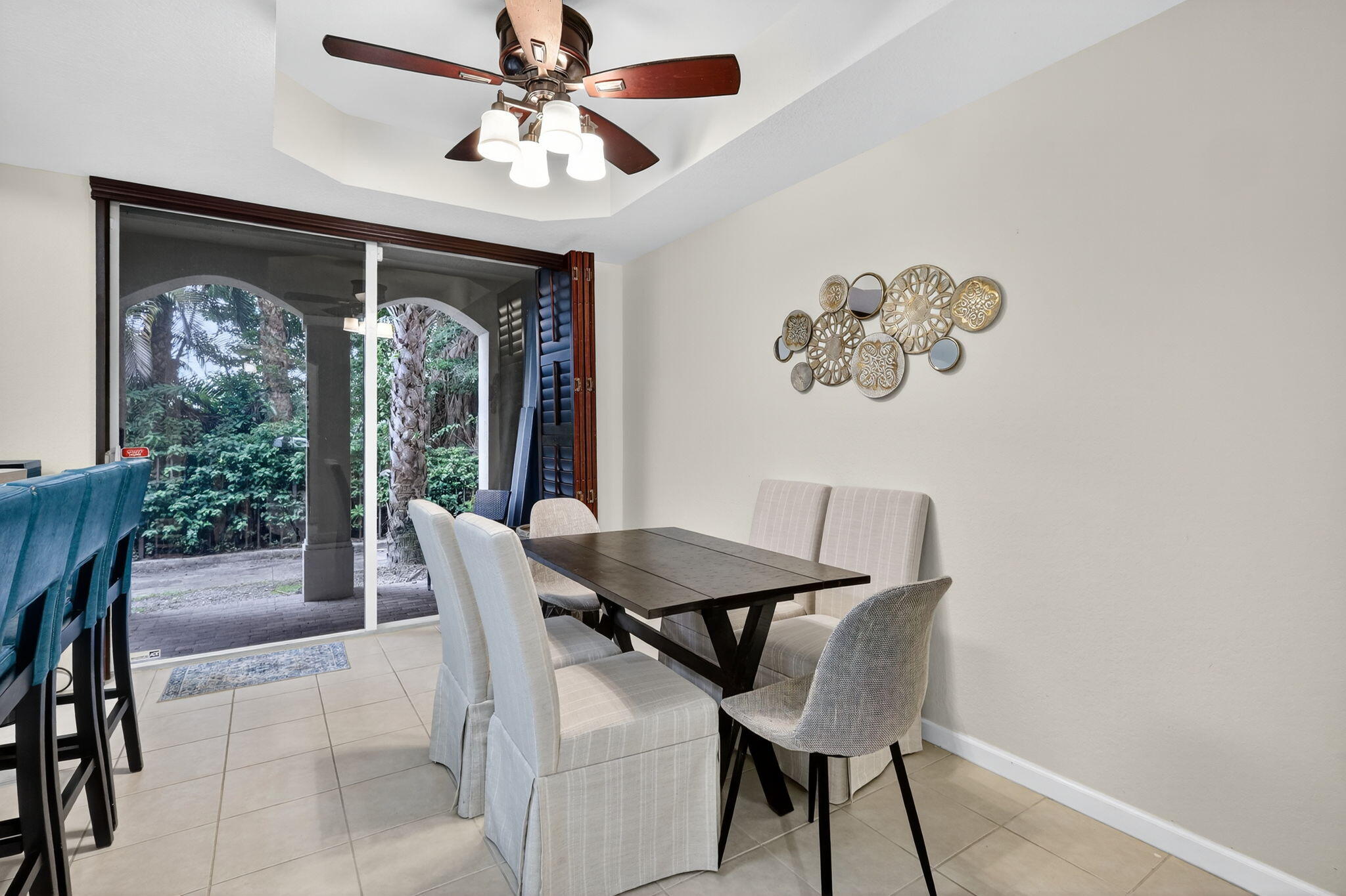 2931 Hope Valley Street, Unit 405 West Palm Beach, FL 33411 - Photo 13 of 35 a view of a dining room with furniture window and outside view