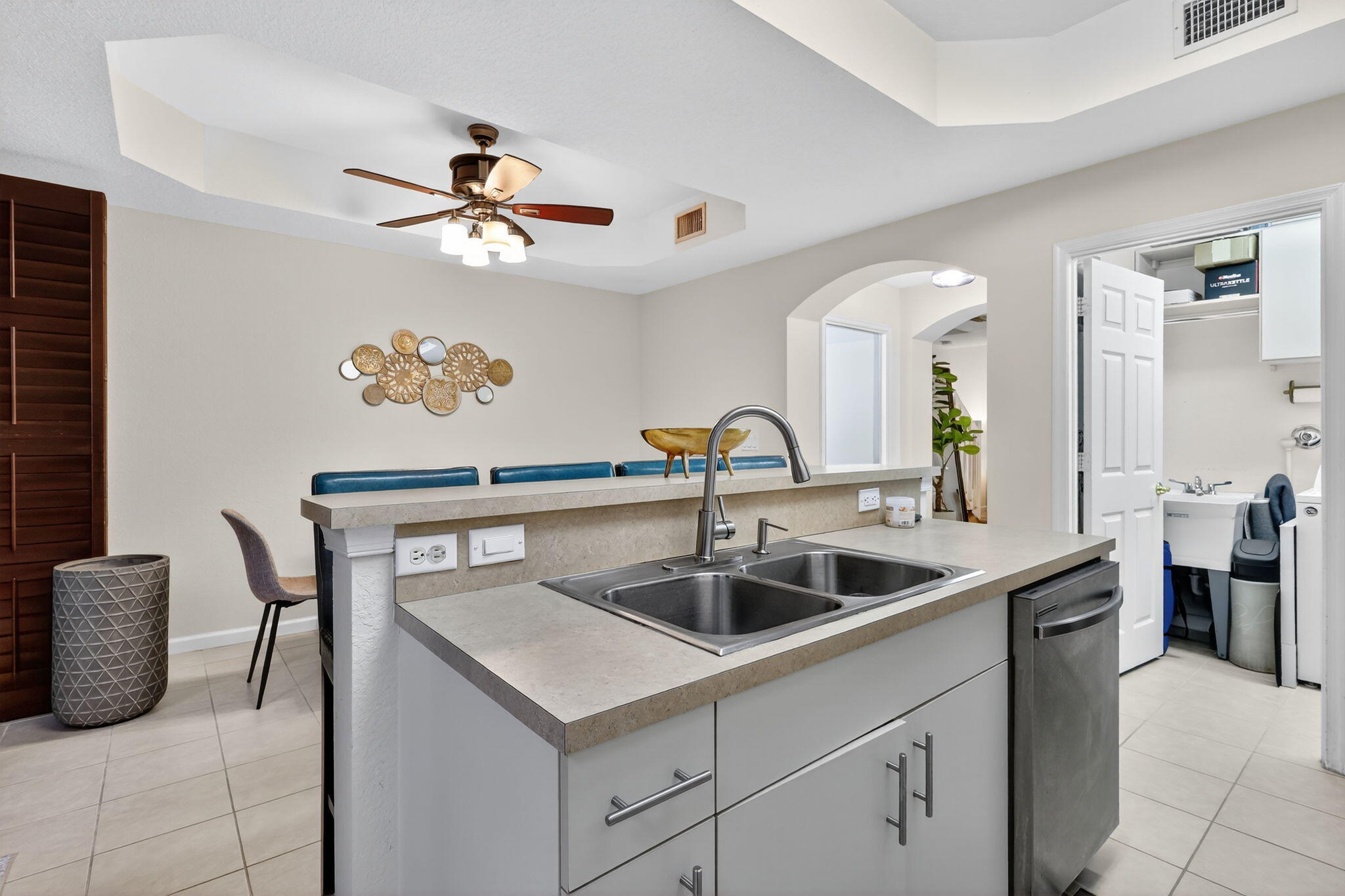 2931 Hope Valley Street, Unit 405 West Palm Beach, FL 33411 - Photo 16 of 35 a kitchen with a sink and cabinets