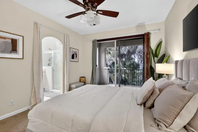 a bedroom with a large bed and a window