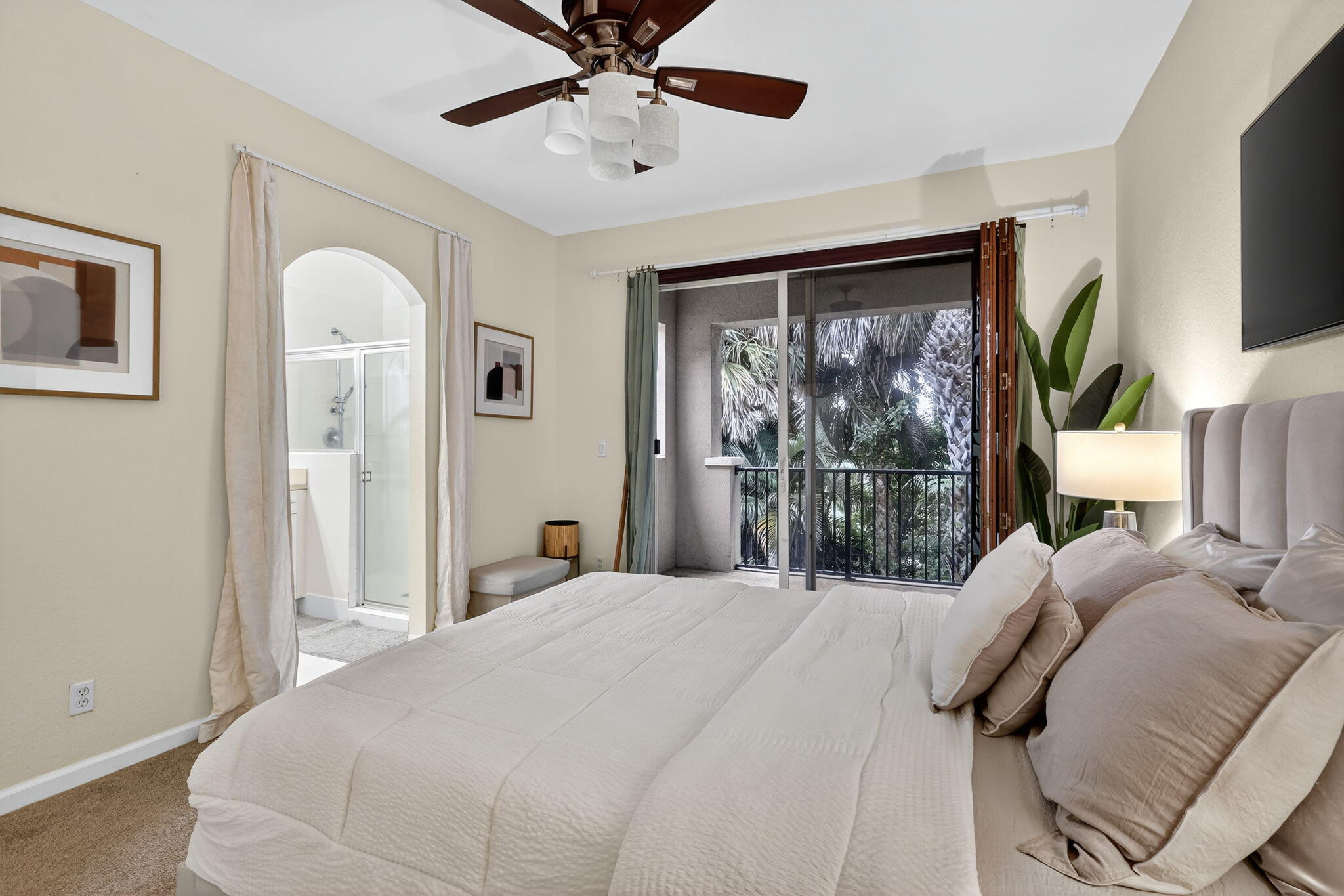 2931 Hope Valley Street, Unit 405 West Palm Beach, FL 33411 - Photo 21 of 35 a bedroom with a large bed and a window