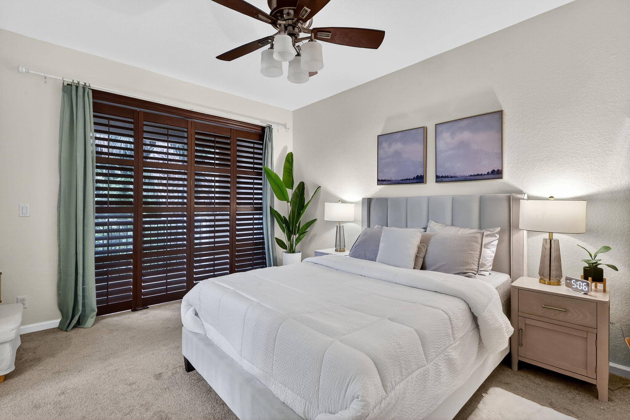 2931 Hope Valley Street, Unit 405 West Palm Beach, FL 33411 - Photo 22 of 35 a bedroom with a bed and a chandelier