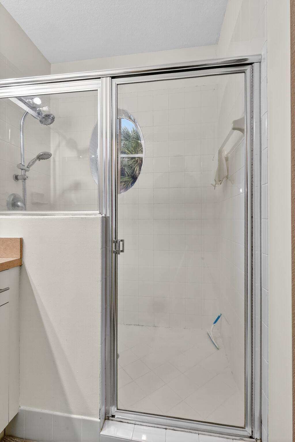 2931 Hope Valley Street, Unit 405 West Palm Beach, FL 33411 - Photo 23 of 35 a bathroom with a glass shower door