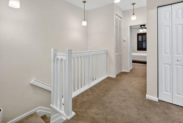 a view of a hallway with closet area