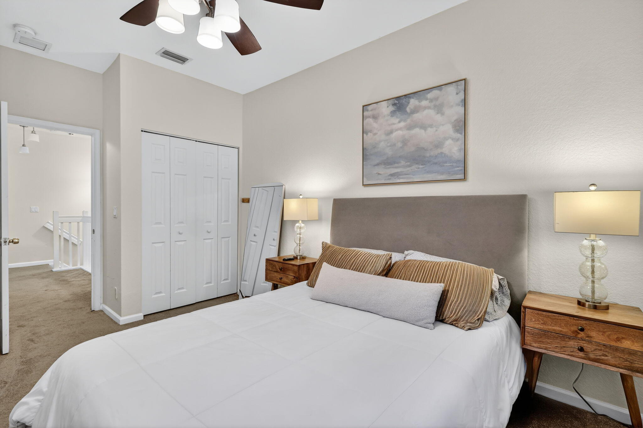 2931 Hope Valley Street, Unit 405 West Palm Beach, FL 33411 - Photo 29 of 35 a bedroom with a bed and a lamp