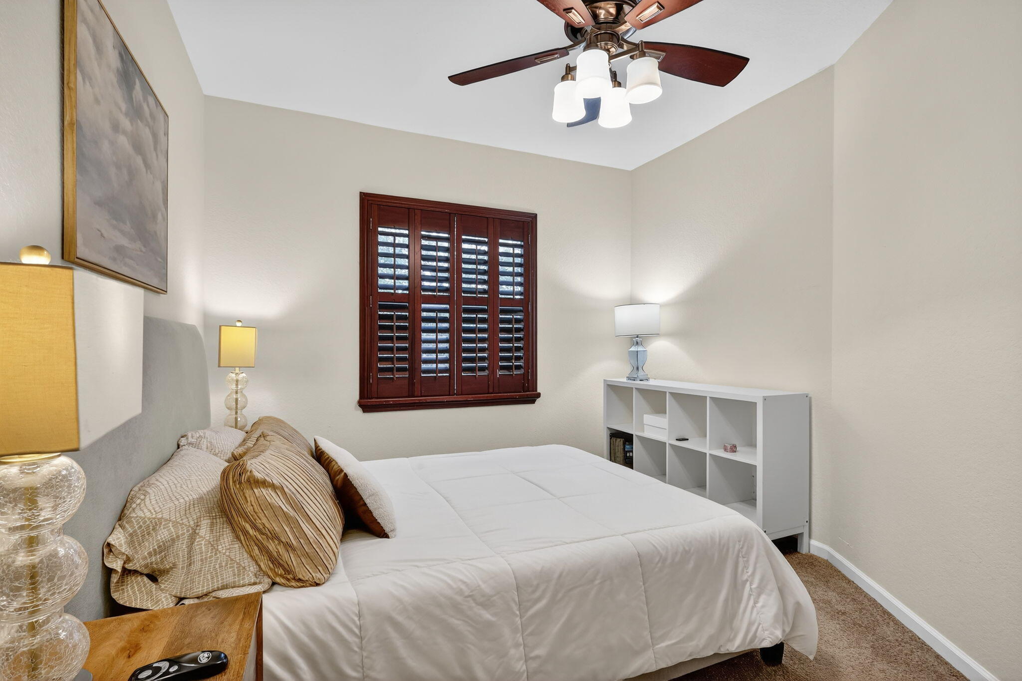 2931 Hope Valley Street, Unit 405 West Palm Beach, FL 33411 - Photo 30 of 35 a bedroom with a large bed and a chandelier