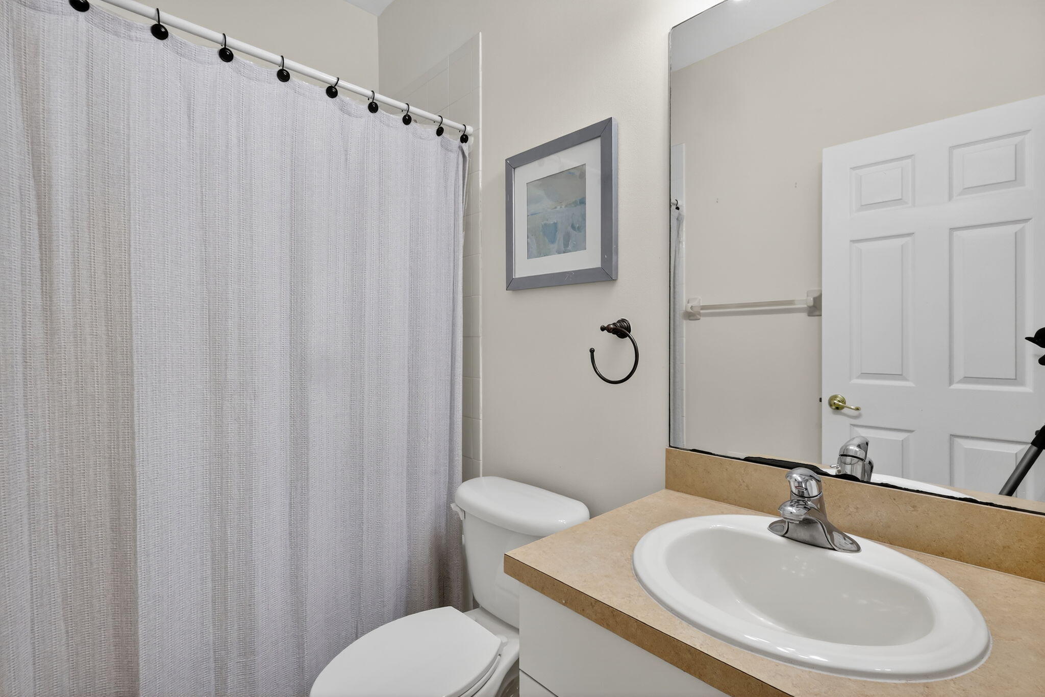 2931 Hope Valley Street, Unit 405 West Palm Beach, FL 33411 - Photo 33 of 35 a bathroom with a sink toilet and shower