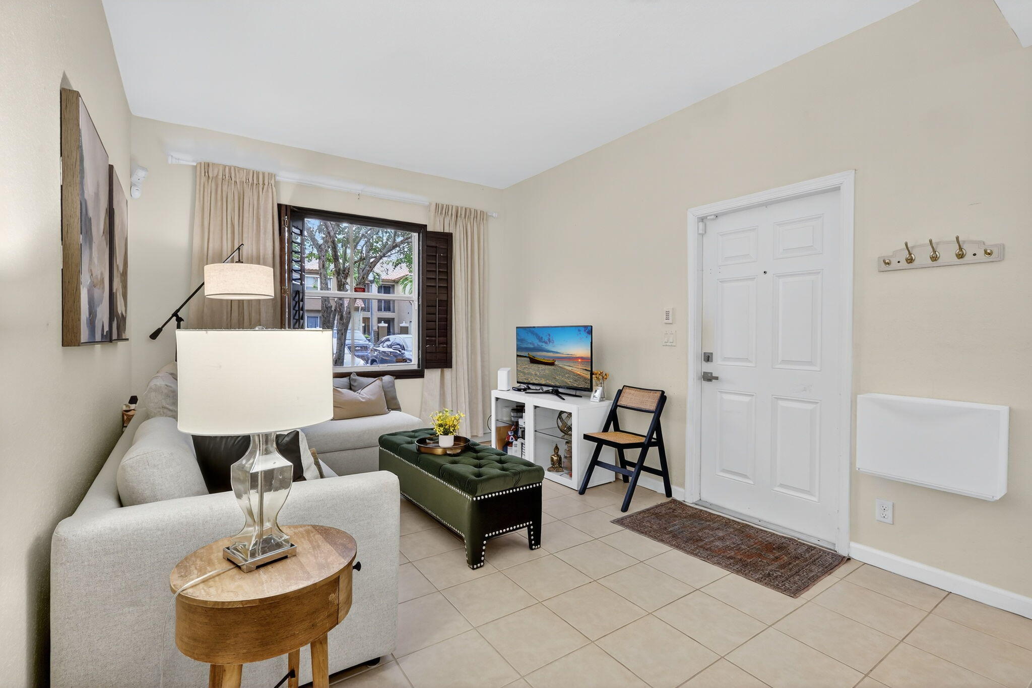 2931 Hope Valley Street, Unit 405 West Palm Beach, FL 33411 - Photo 4 of 35 a living room with furniture and a window