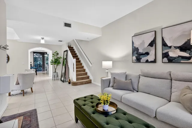 a living room with furniture and a couch