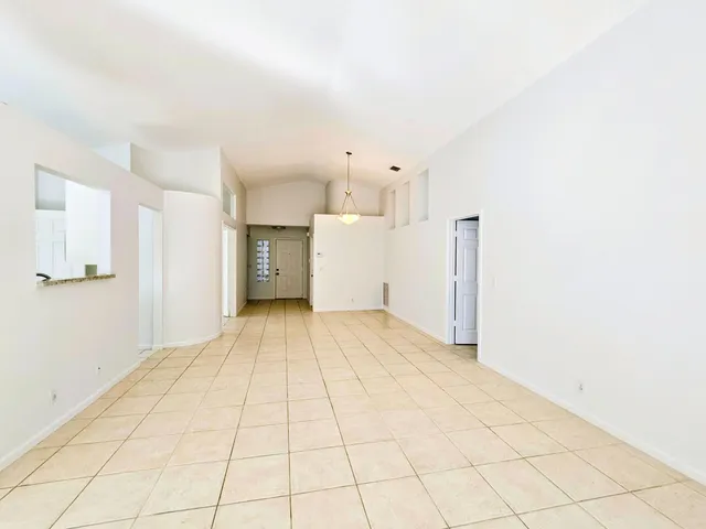a view of a room with a refrigerator
