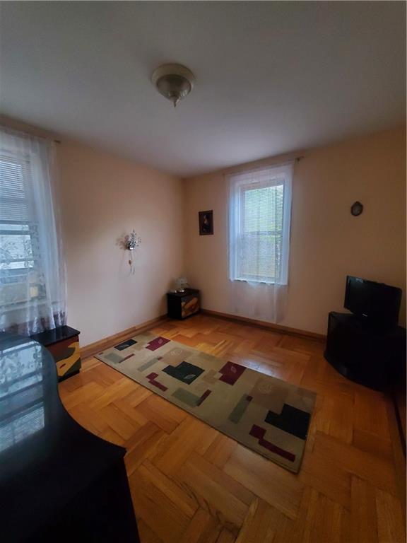 1053 East 13th Street, Unit B1 Brooklyn, NY 11230 - Photo 12 of 17 a bedroom with a bed and window