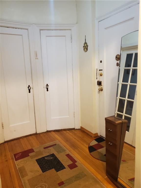 1053 East 13th Street, Unit B1 Brooklyn, NY 11230 - Photo 2 of 17 a bedroom with a bed and cabinets