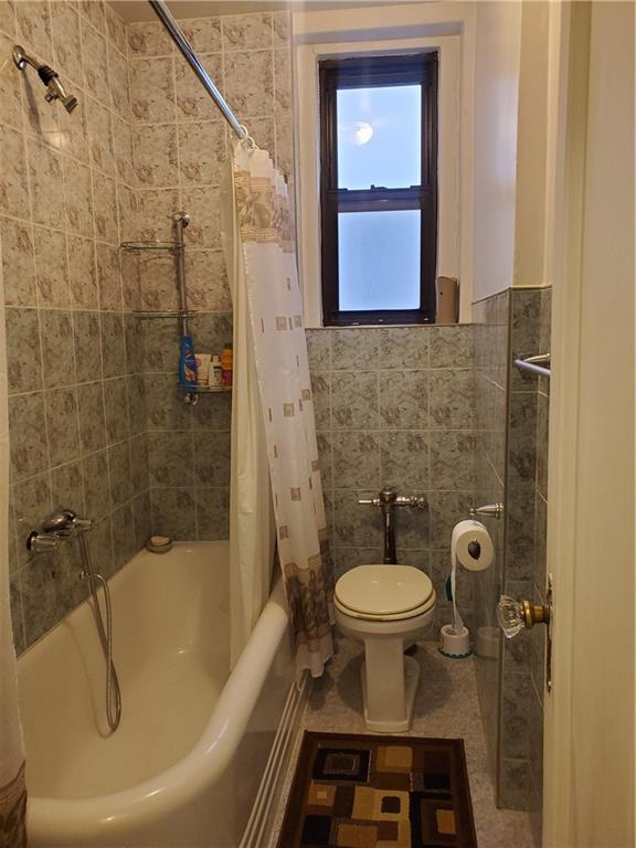 1053 East 13th Street, Unit B1 Brooklyn, NY 11230 - Photo 9 of 17 a bathroom with a sink toilet and shower