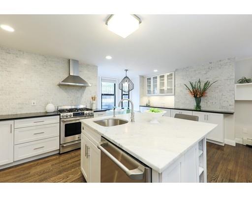 14 Thomas Park Boston, MA 02127 - Photo 4 of 20 a kitchen with a stove a sink and a refrigerator