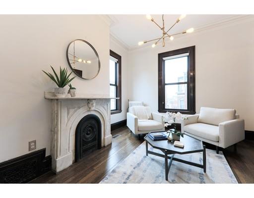 14 Thomas Park Boston, MA 02127 - Photo 7 of 20 a living room with furniture and a fireplace