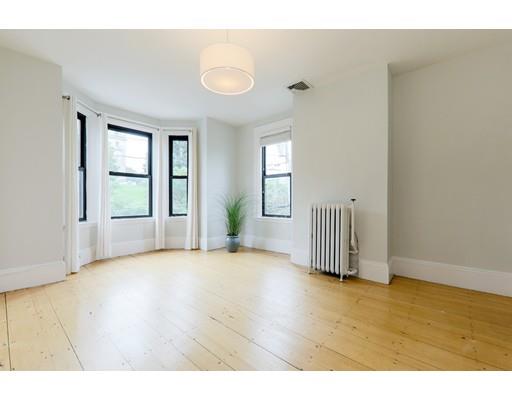 14 Thomas Park Boston, MA 02127 - Photo 9 of 20 a view of empty room with wooden floor and fan