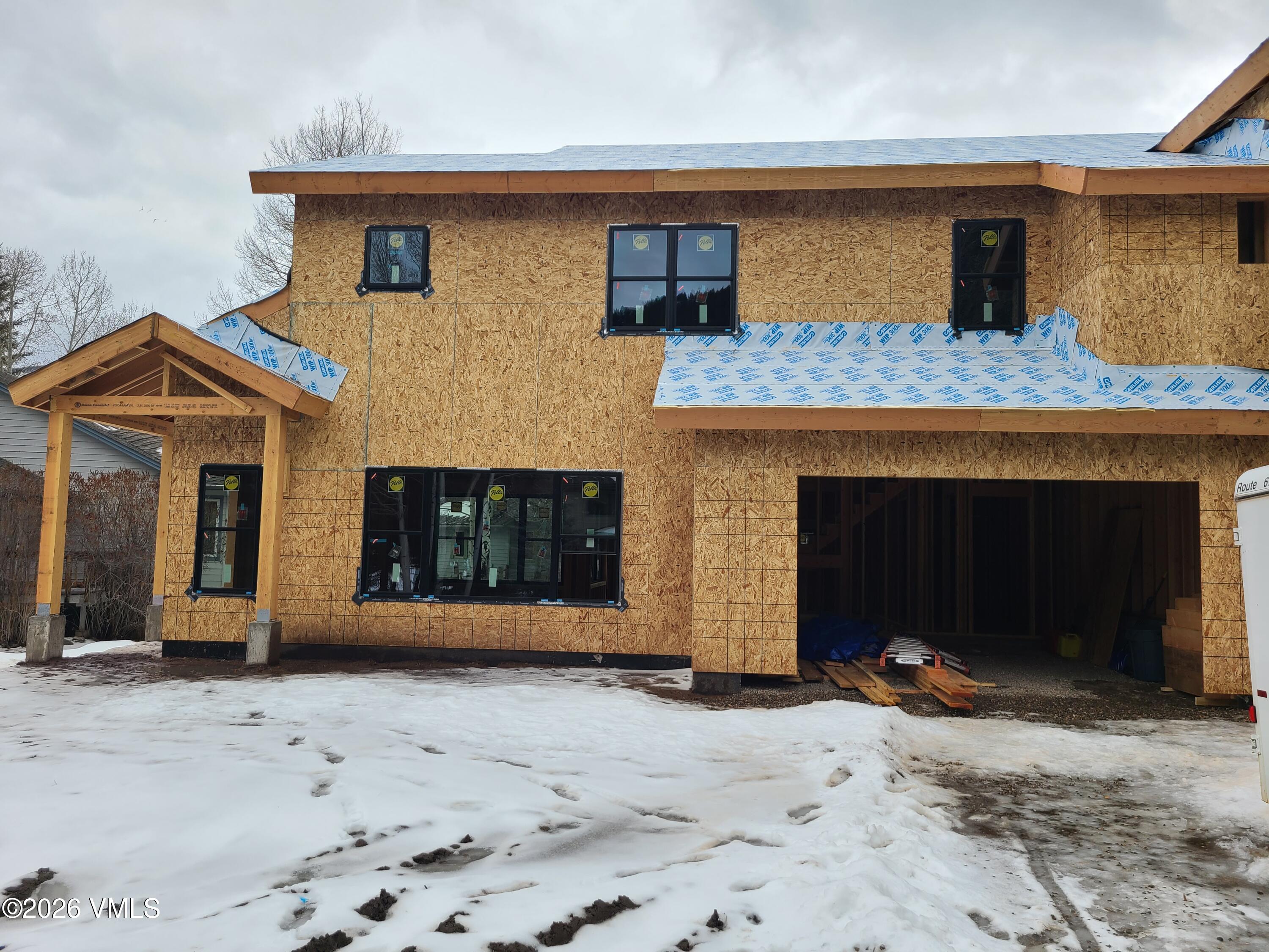41 Grouse Court, Unit NORTH Avon, CO 81620 - Photo 2 of 7 a front view of a house