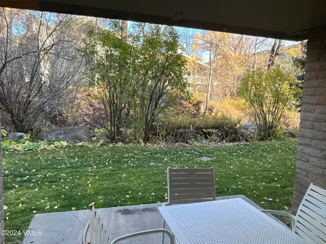 a view of backyard with green space