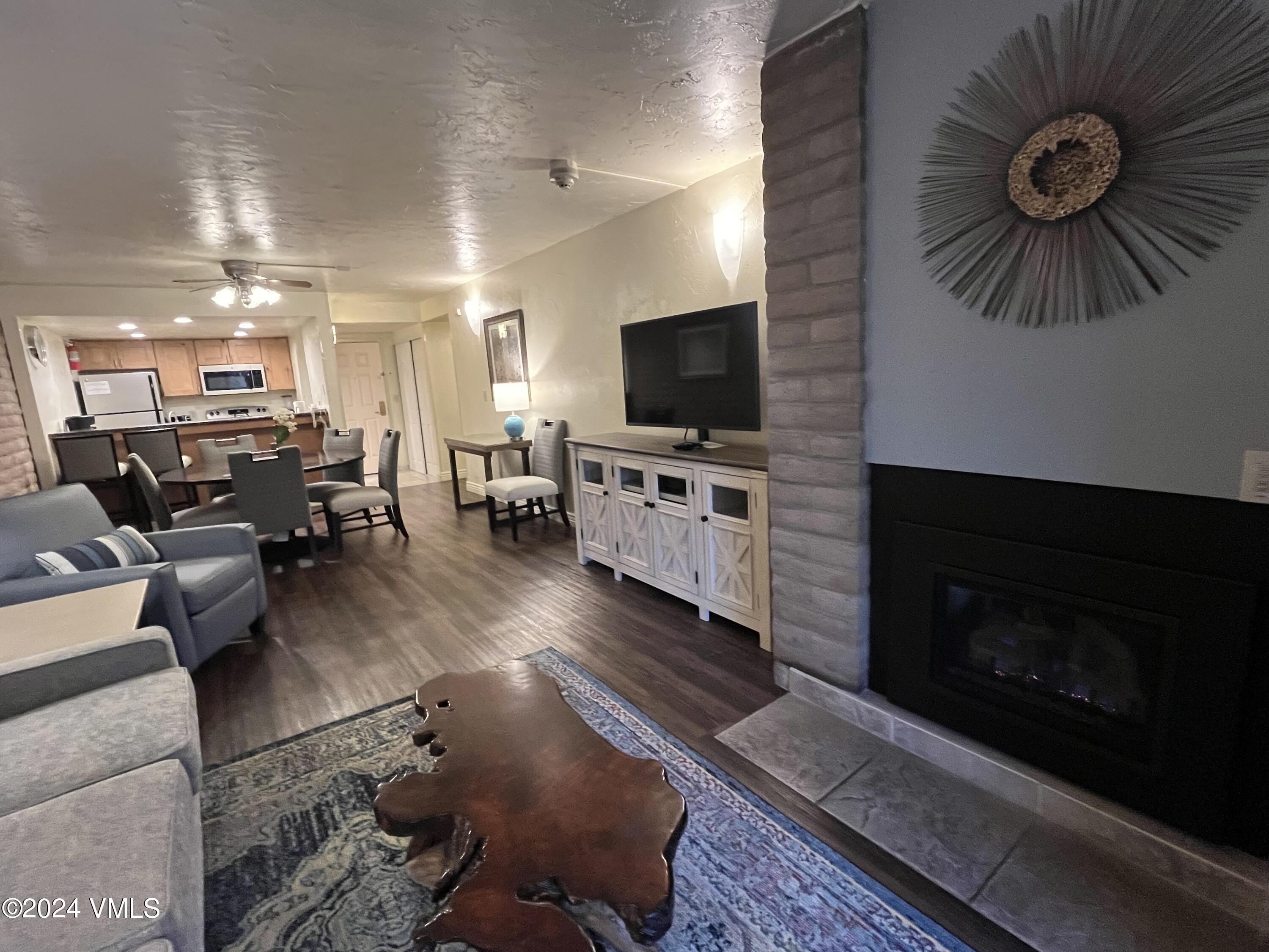 1020 Vail View Drive, Unit 310438 Vail, CO 81657 - Photo 6 of 25 a living room with furniture and a flat screen tv