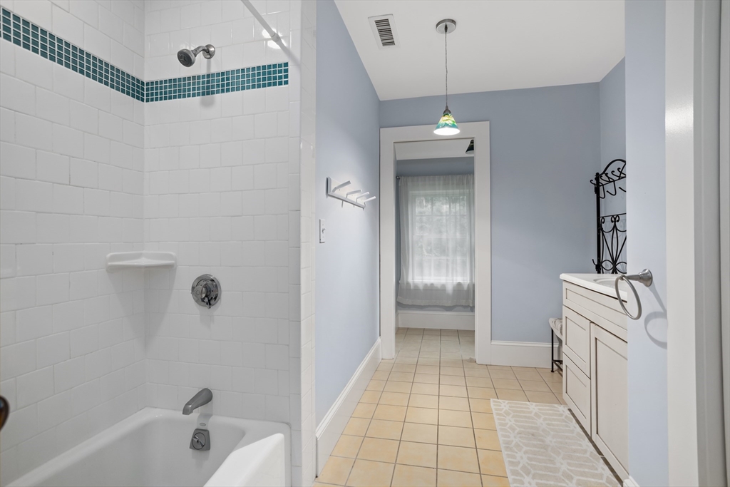 244 Lincoln Road Lincoln, MA 01773 - Photo 24 of 41 a bathroom with a sink a toilet and shower