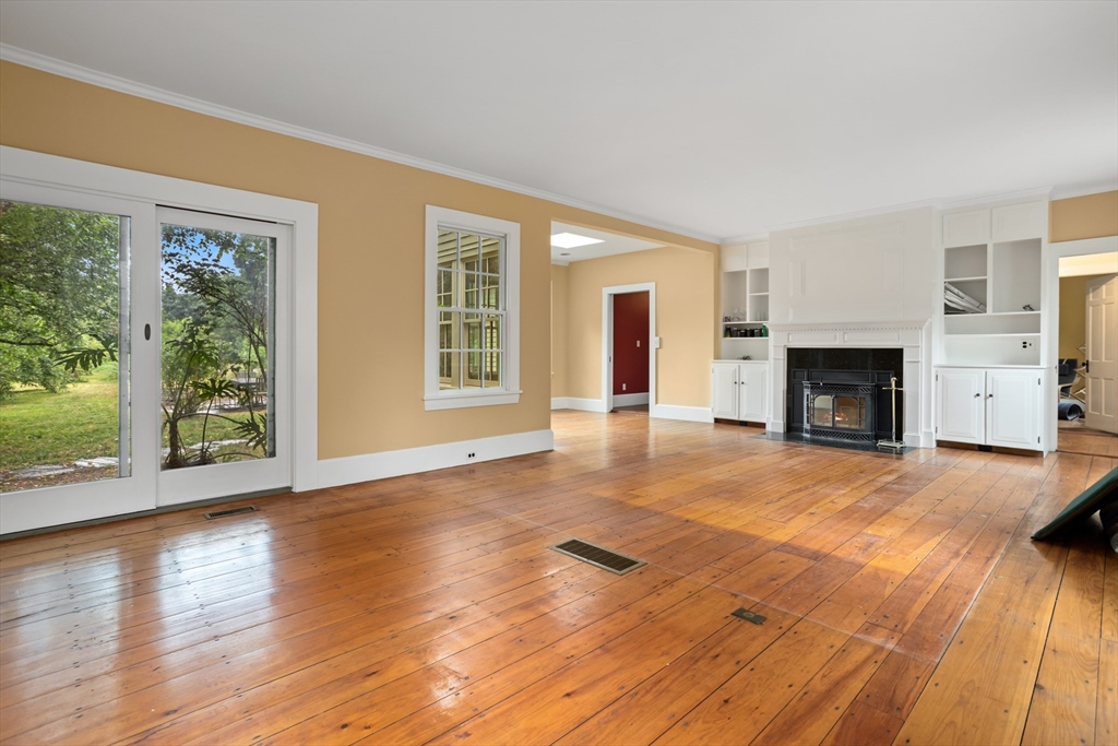 244 Lincoln Road Lincoln, MA 01773 - Photo 26 of 41 a view of an empty room with wooden floor and a window