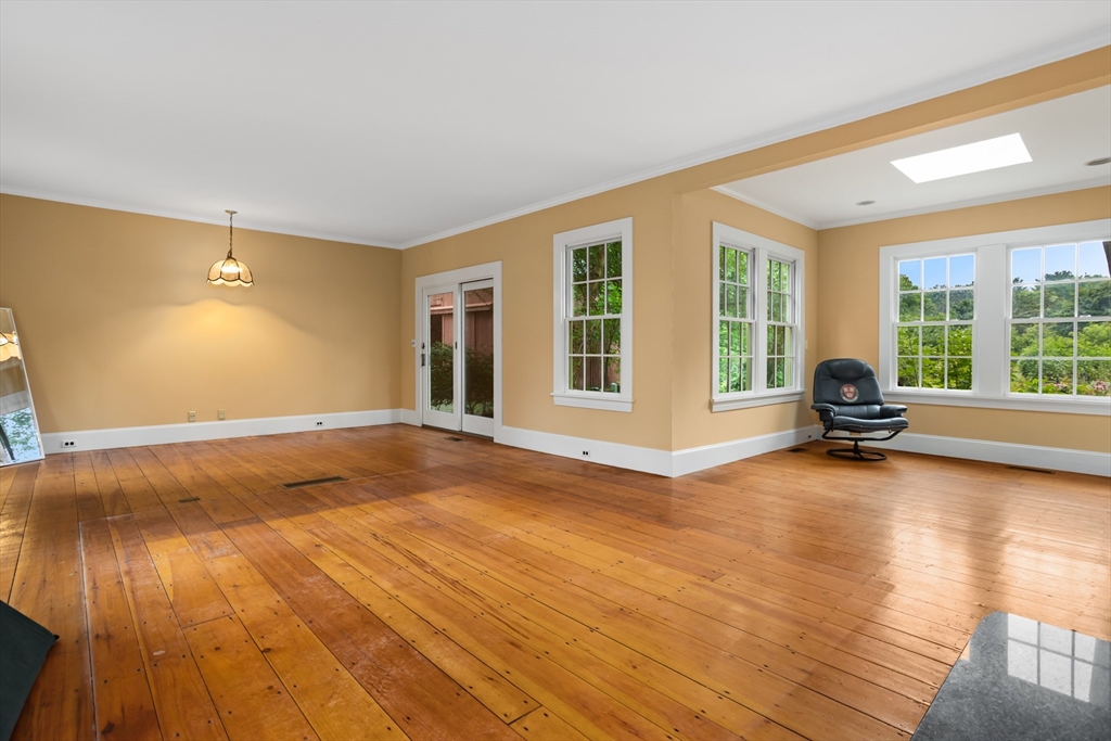 244 Lincoln Road Lincoln, MA 01773 - Photo 6 of 41 a view of empty room with wooden floor and floor to ceiling window