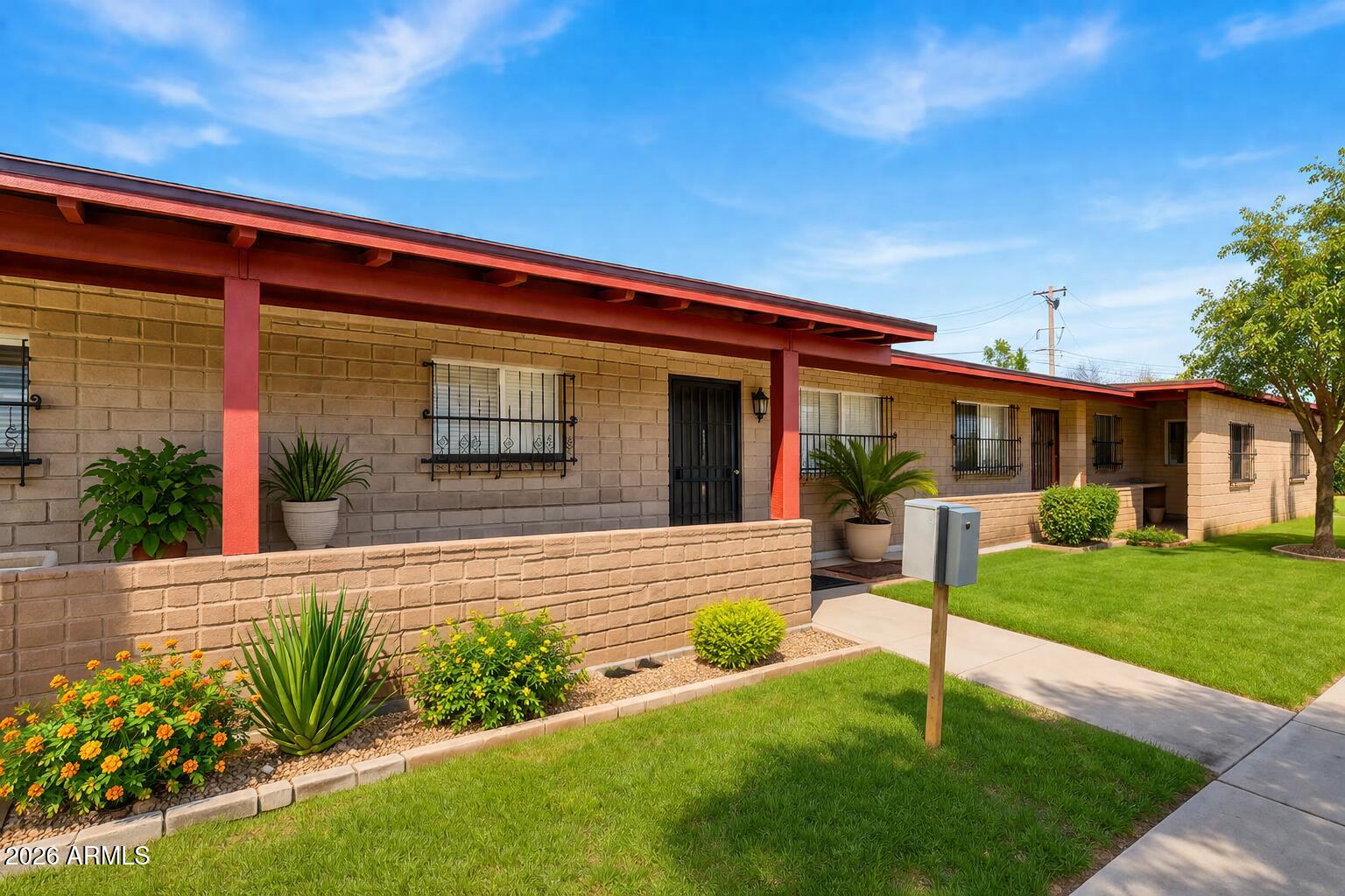 6735 North 16th Street, Unit 4 Phoenix, AZ 85016 - Photo 12 of 27 a front view of a house with garden