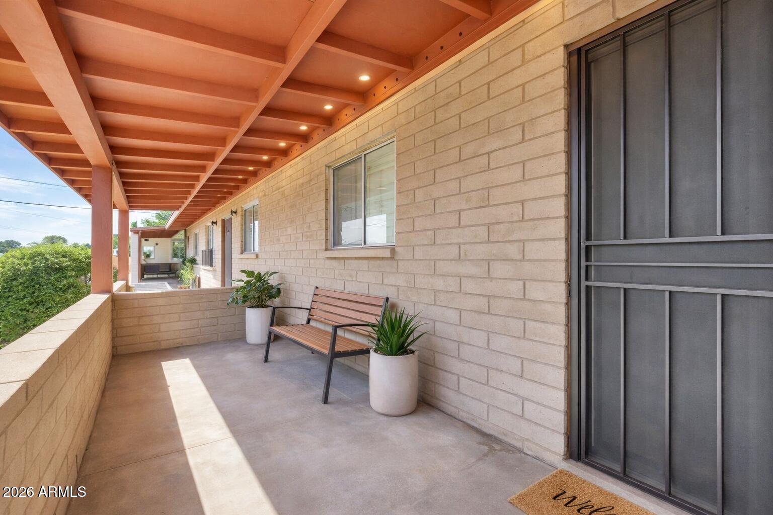 6735 North 16th Street, Unit 4 Phoenix, AZ 85016 - Photo 26 of 27 a building outdoor space with patio furniture and potted plants