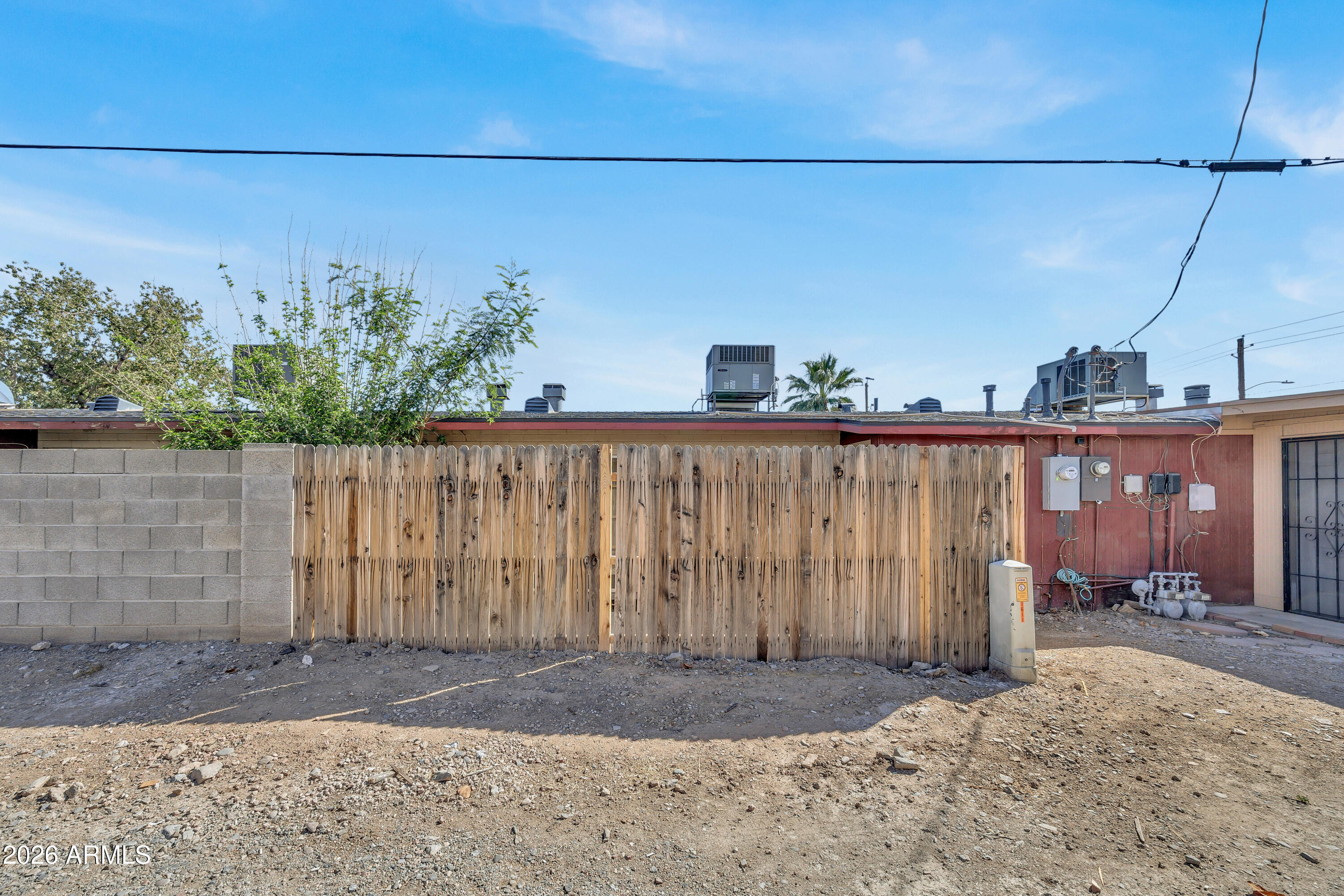 6735 North 16th Street, Unit 4 Phoenix, AZ 85016 - Photo 27 of 27 a view of a pathway with a wooden fence