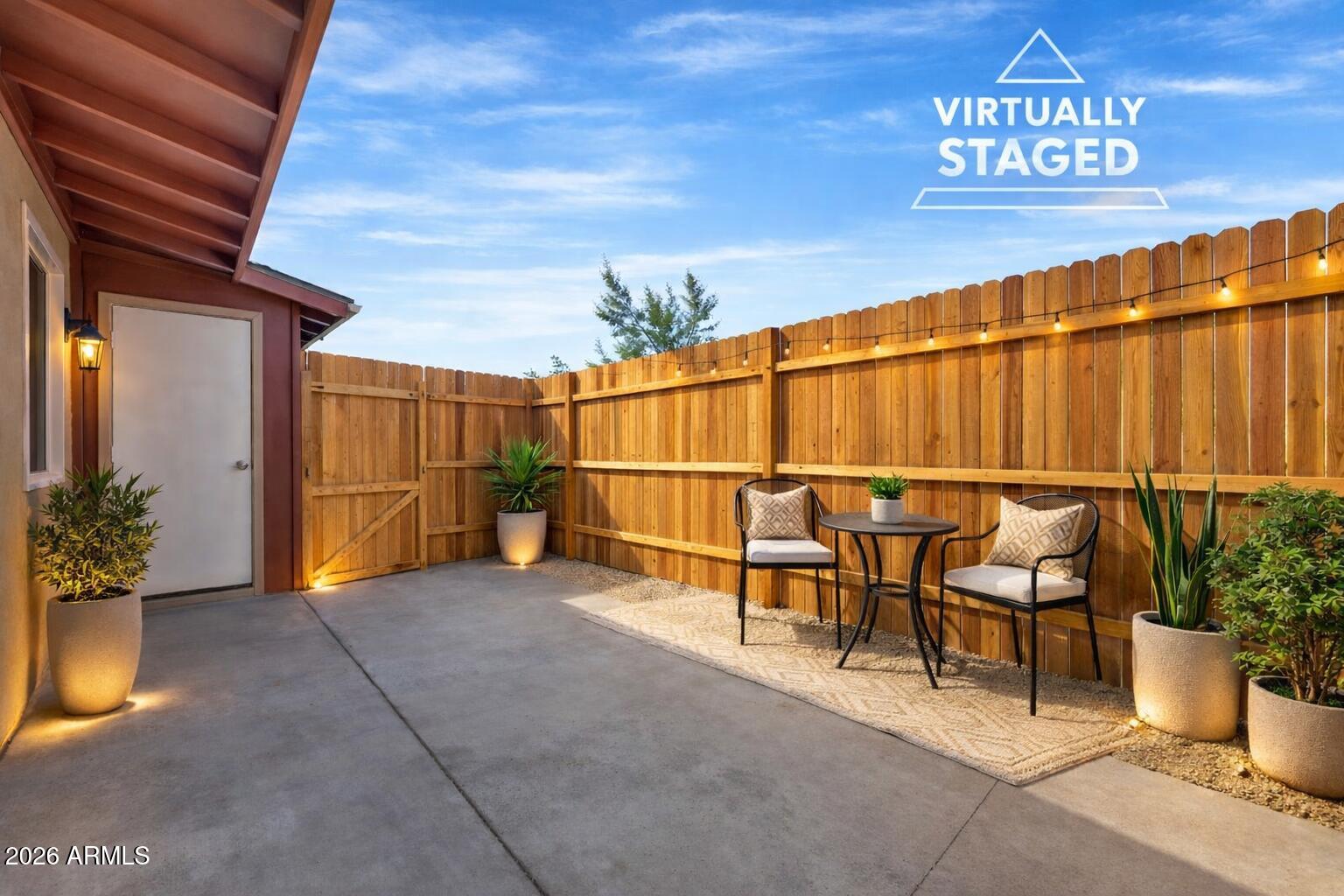 6735 North 16th Street, Unit 4 Phoenix, AZ 85016 - Photo 10 of 27 a view of a chairs and table in the backyard