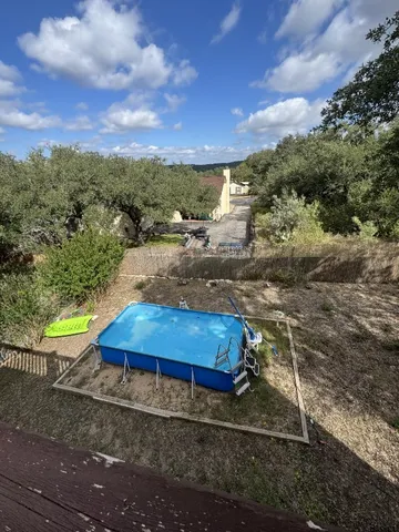 a view of a yard with an outdoor space
