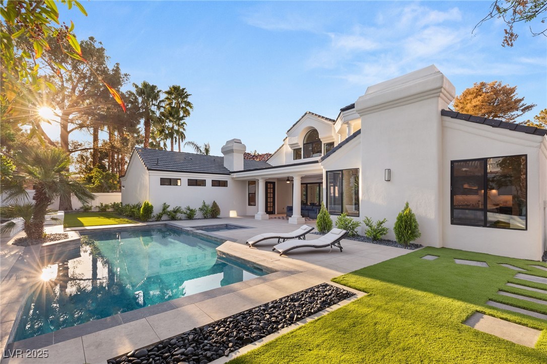 2316 Prometheus Court Henderson, NV 89074 - Photo 56 of 92 Rear view of house featuring a tiled roof, a patio area, stucco siding, and a lawn