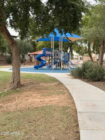 a view of a swimming pool with a patio