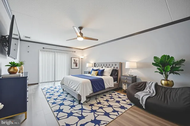 a bedroom with furniture and a chandelier