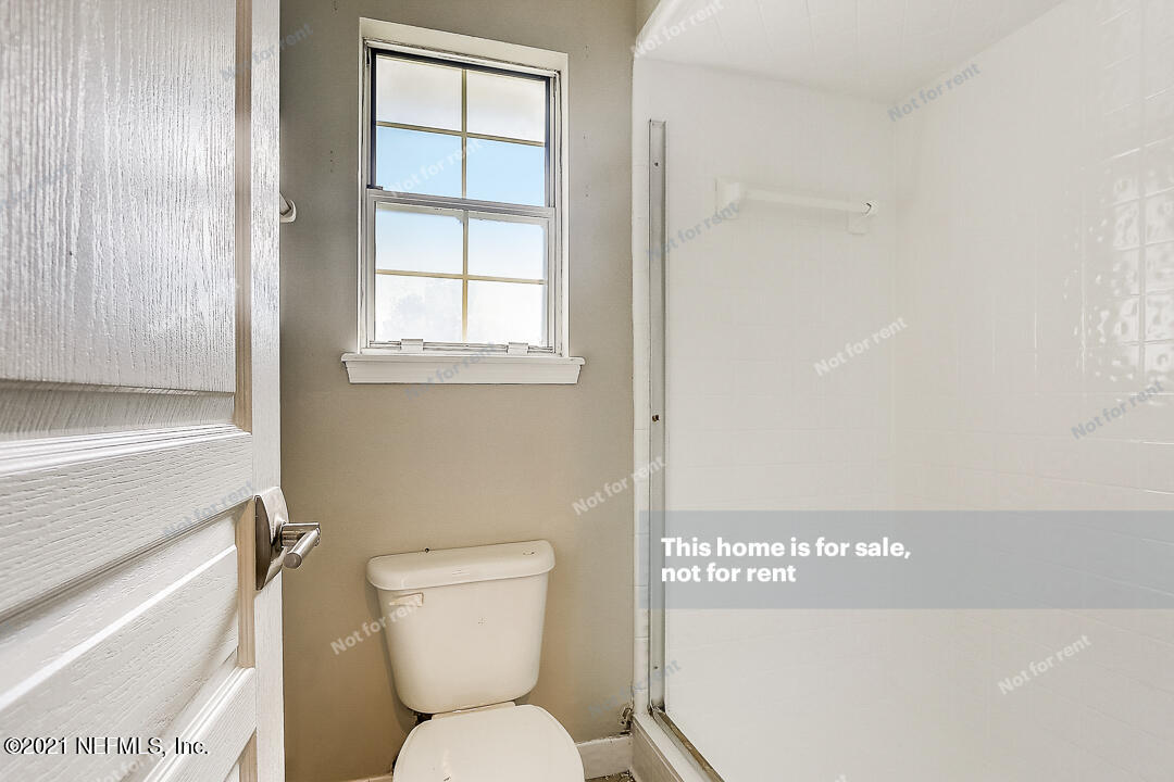 328 North Ridge Drive Orange Park, FL 32003 - Photo 25 of 33 a bathroom with a toilet and a shower