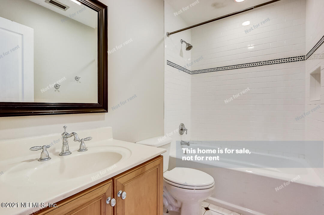 328 North Ridge Drive Orange Park, FL 32003 - Photo 27 of 33 a bathroom with a sink a toilet and a mirror