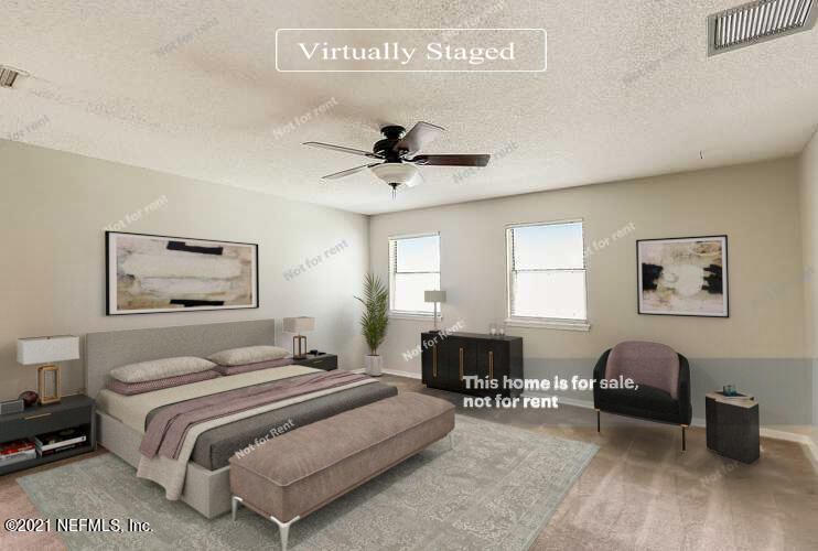 328 North Ridge Drive Orange Park, FL 32003 - Photo 3 of 33 a bedroom with a bed couches and a window