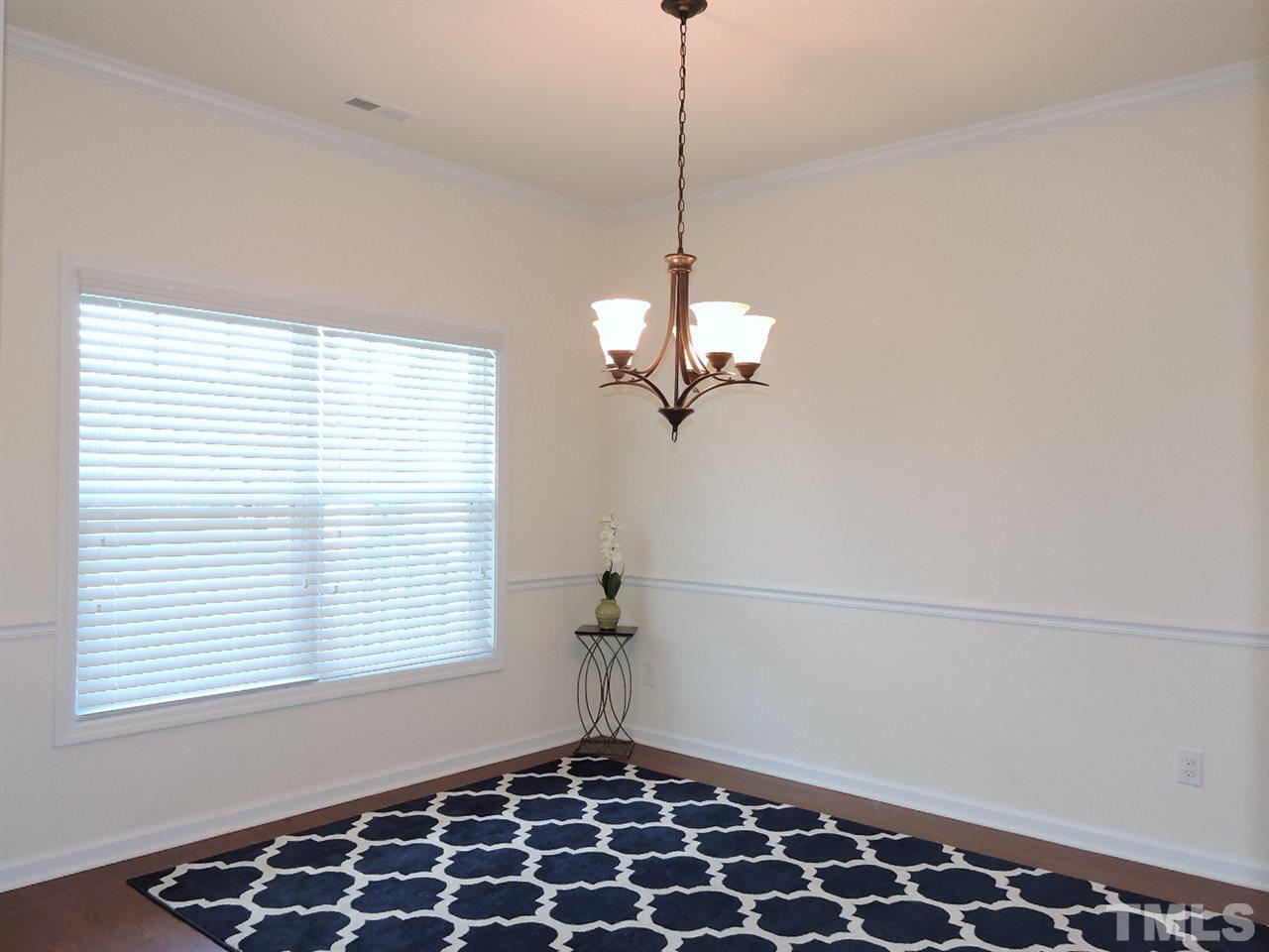 3406 Alman Drive Durham, NC 27705 - Photo 2 of 23 a view of a room with a window and wooden floor