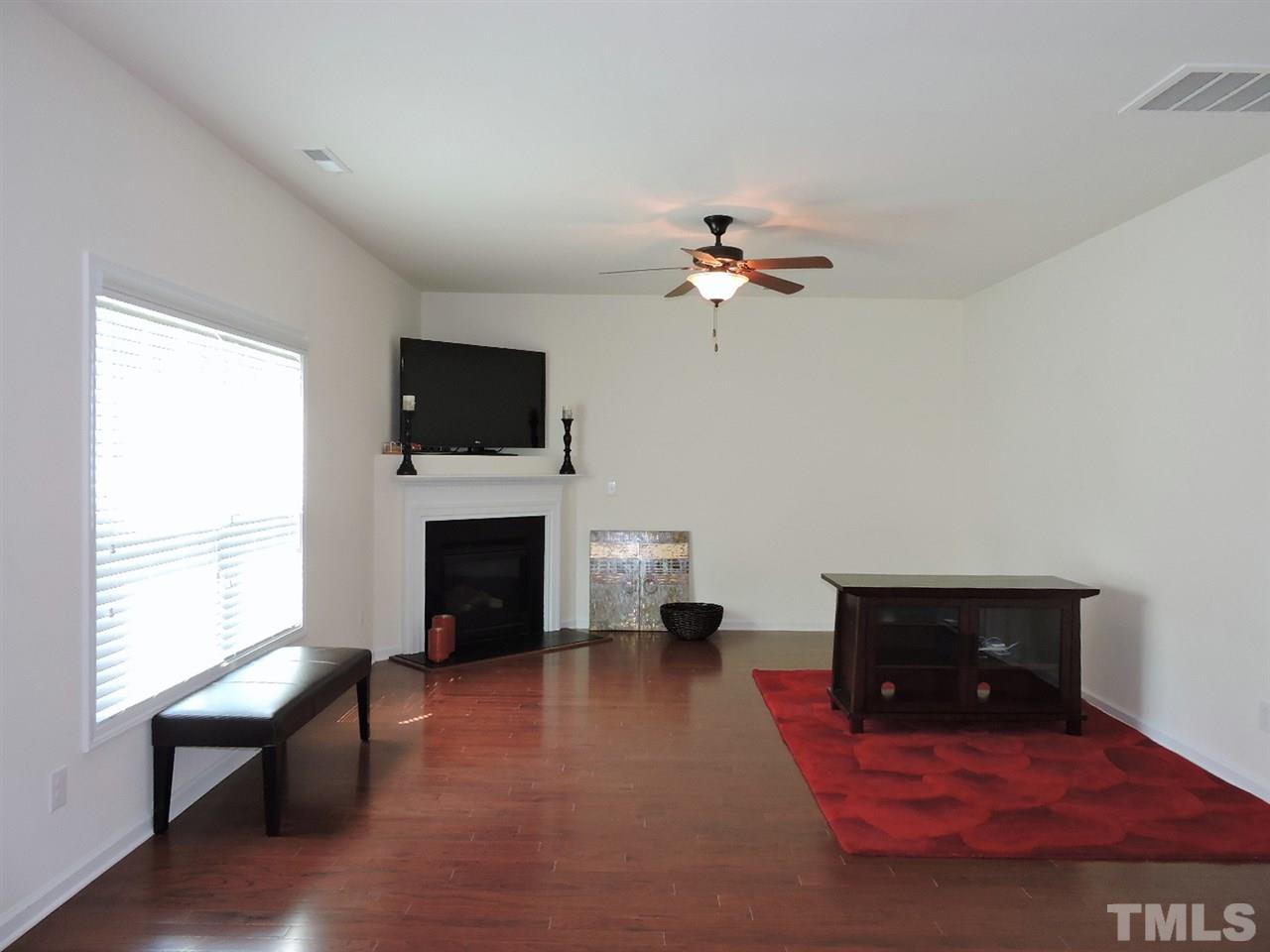 3406 Alman Drive Durham, NC 27705 - Photo 11 of 23 a living room with furniture and a fireplace