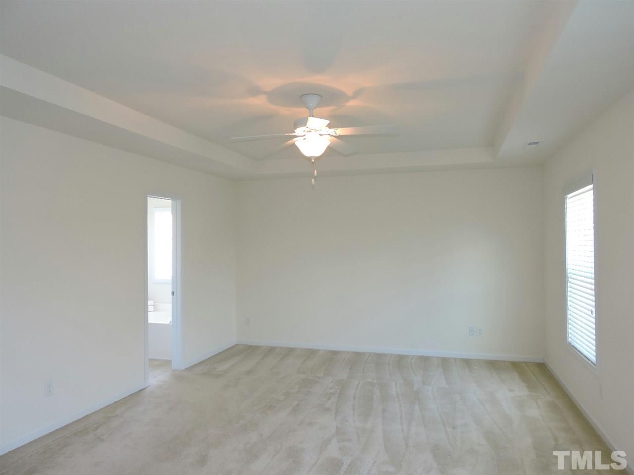 3406 Alman Drive Durham, NC 27705 - Photo 13 of 23 wooden floor in an empty room with a window