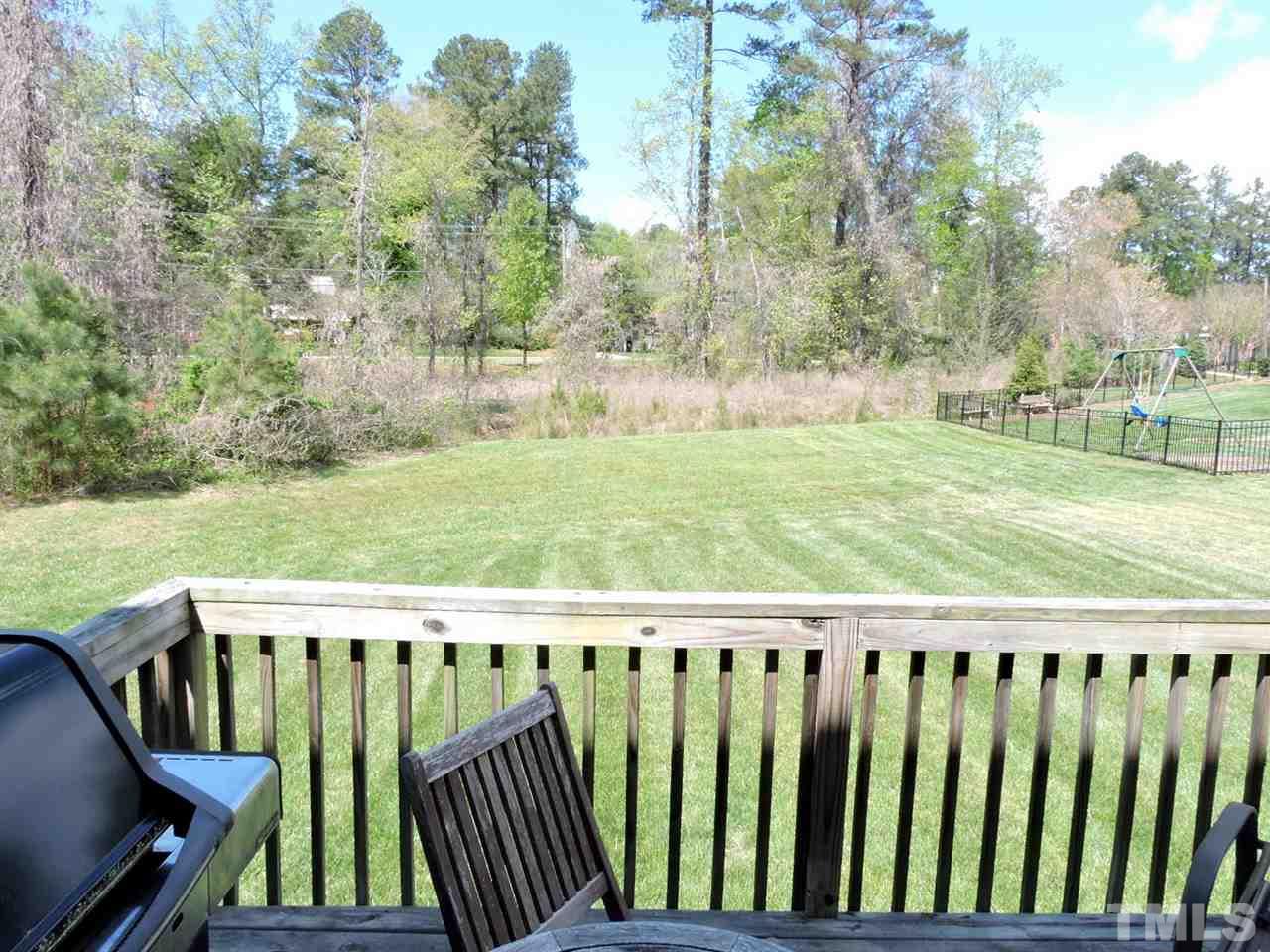 3406 Alman Drive Durham, NC 27705 - Photo 21 of 23 a view of a wooden deck with yard and trees