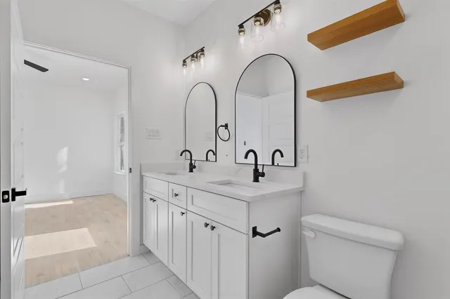 a bathroom with a sink and mirror