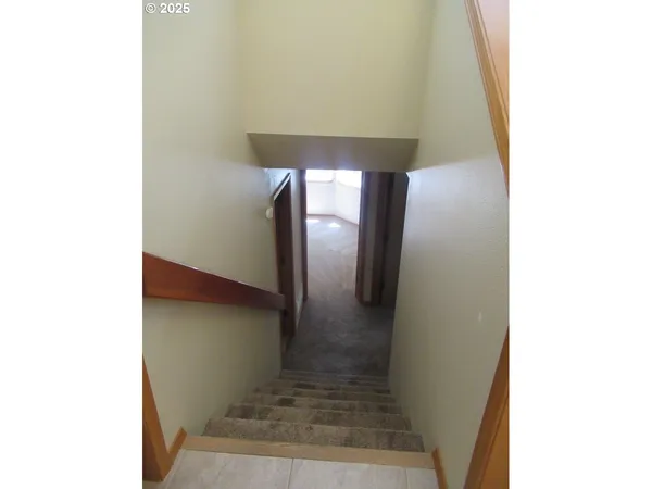 an empty room with wooden floor