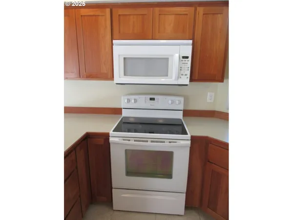 a kitchen with a stove and a microwave